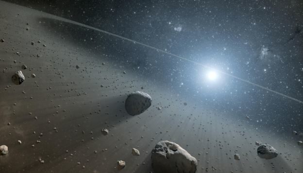 Asteroidų žiedo, kuris yra aplink Vegos žvaigždę dailininko įsivaizdavimas (NASA)